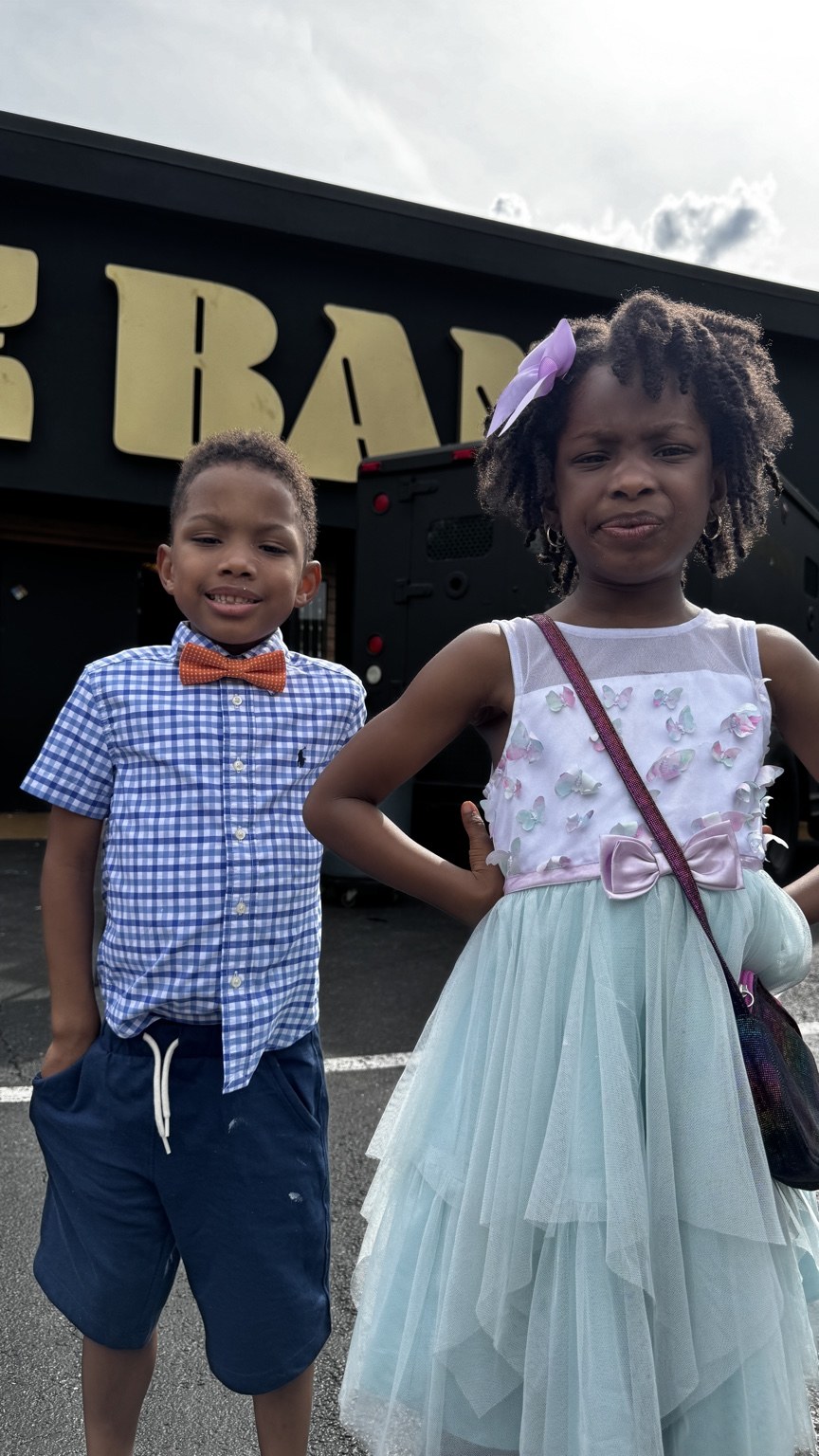 Phil BeLight's children dressed up outdoors